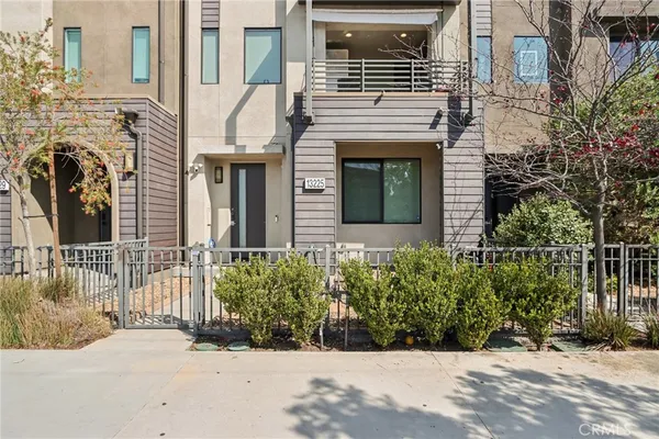 a view of a house with a street