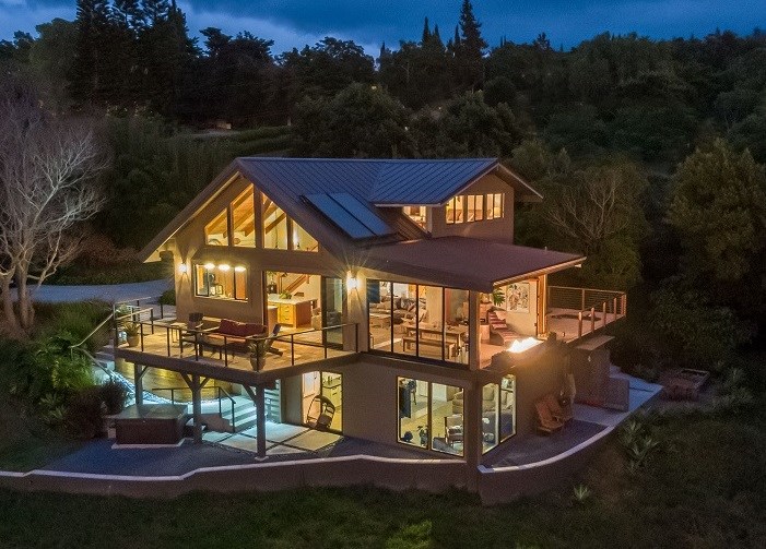 320 Lower Kimo Drive Kula, HI 96790 - Photo 1 of 27 a view of a big house with many windows and a yard