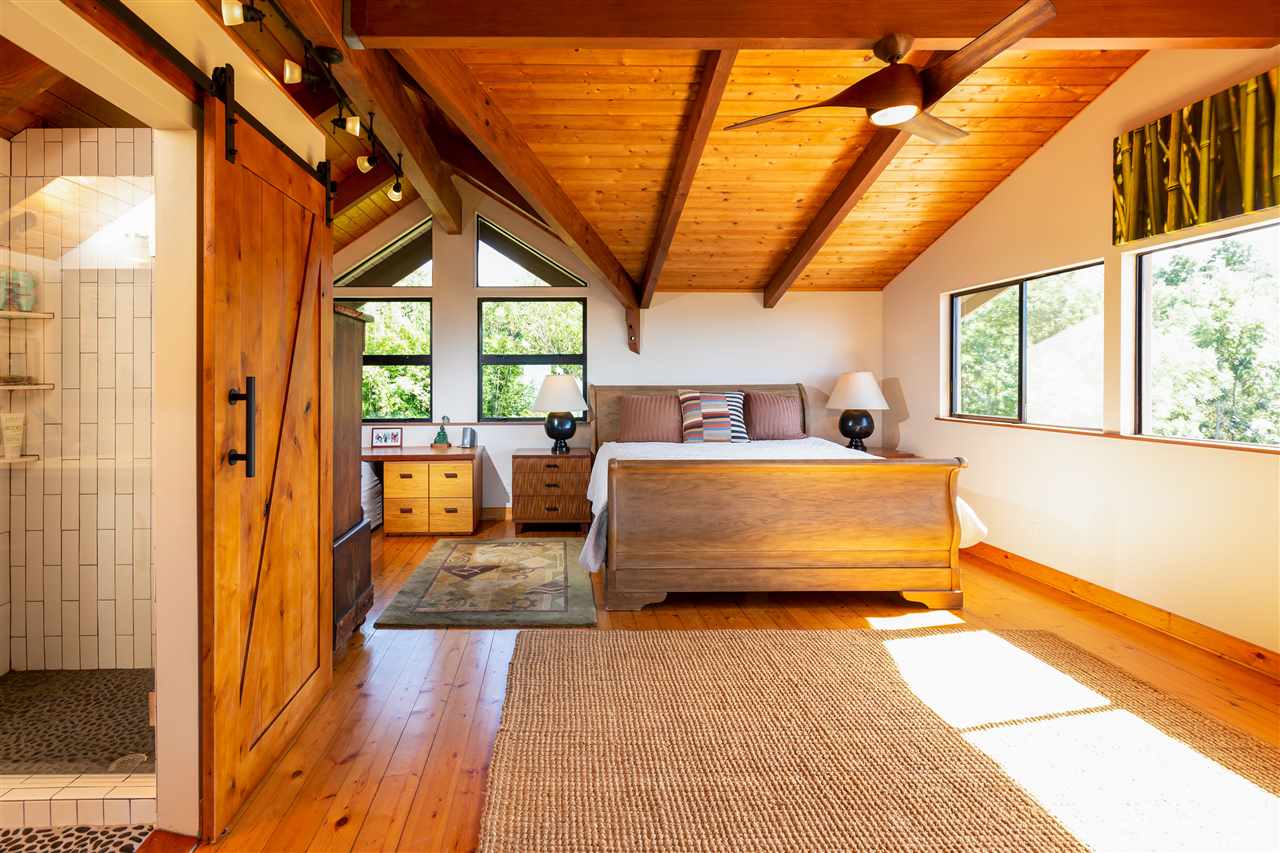 320 Lower Kimo Drive Kula, HI 96790 - Photo 12 of 27 a bedroom with furniture and large windows