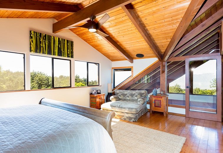 320 Lower Kimo Drive Kula, HI 96790 - Photo 13 of 27 a bedroom with furniture and a large window