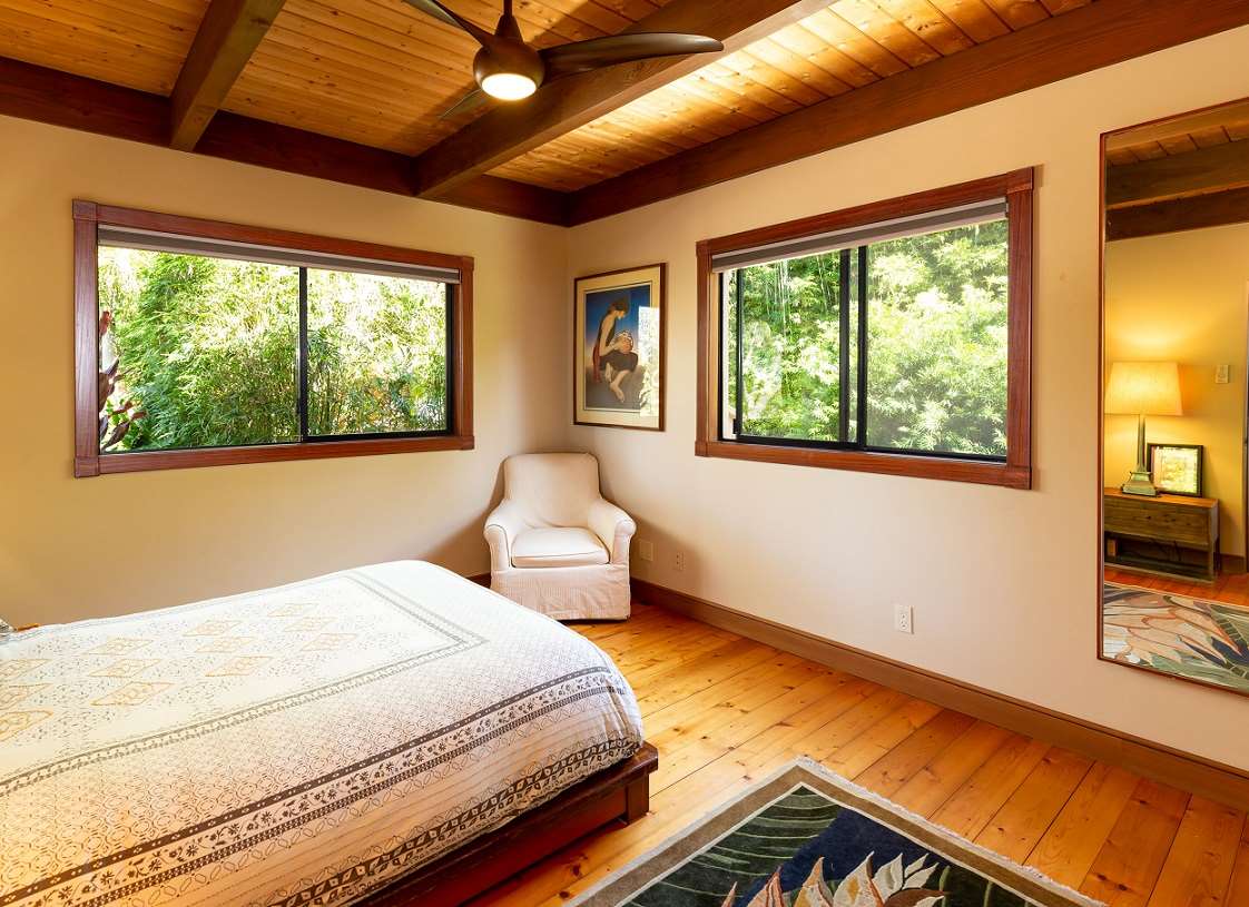 320 Lower Kimo Drive Kula, HI 96790 - Photo 15 of 27 a bedroom with a bed and wooden floor