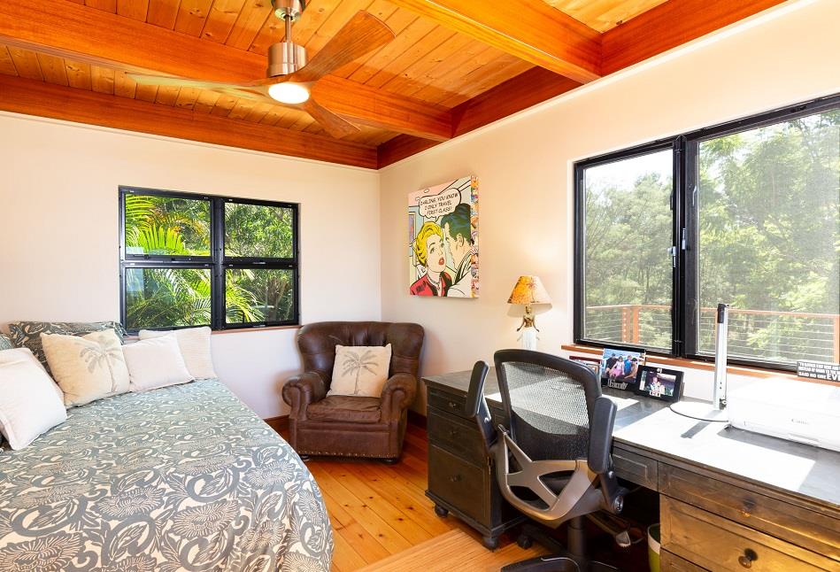 320 Lower Kimo Drive Kula, HI 96790 - Photo 16 of 27 a bedroom with a bed and a chair