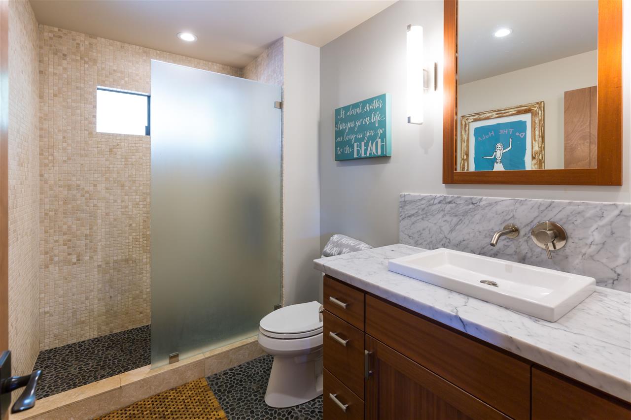 320 Lower Kimo Drive Kula, HI 96790 - Photo 17 of 27 a bathroom with a sink a toilet and mirror