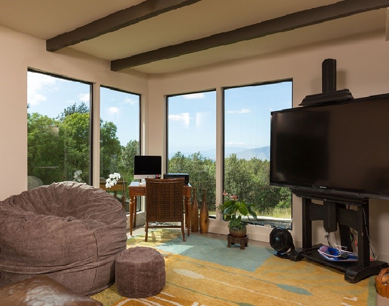 320 Lower Kimo Drive Kula, HI 96790 - Photo 22 of 27 a living room with furniture a large window and a flat screen tv