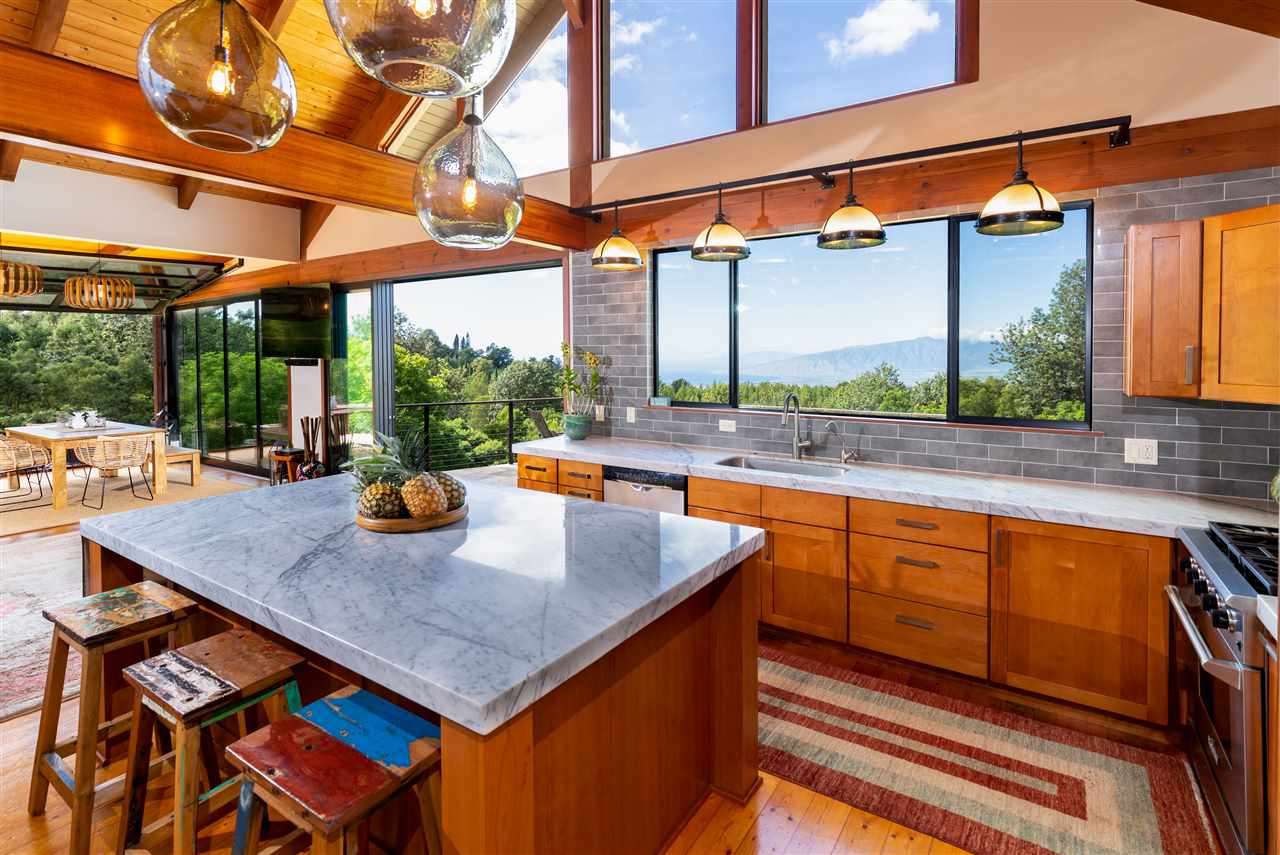 320 Lower Kimo Drive Kula, HI 96790 - Photo 8 of 27 a kitchen view of a sink and table chairs