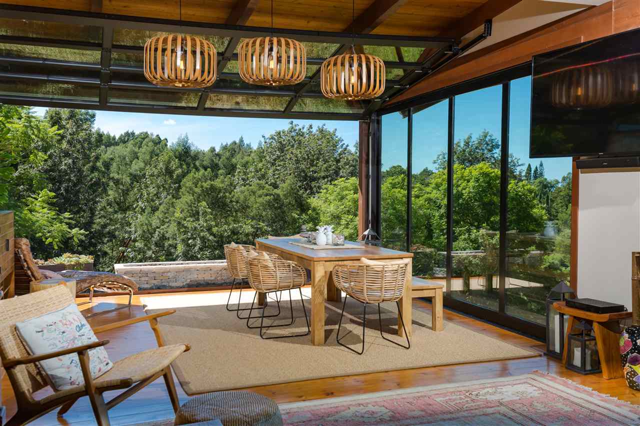 320 Lower Kimo Drive Kula, HI 96790 - Photo 10 of 27 a patio with table and chairs and potted plants