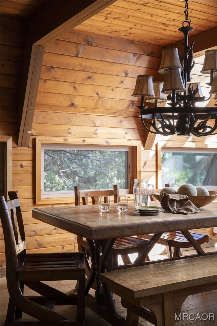27710 West Shore Road Lake Arrowhead, CA 92352 - Photo 11 of 47 a view of a dining room with furniture window and outside view