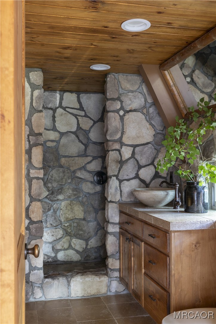 27710 West Shore Road Lake Arrowhead, CA 92352 - Photo 14 of 47 a bathroom with a sink and a mirror