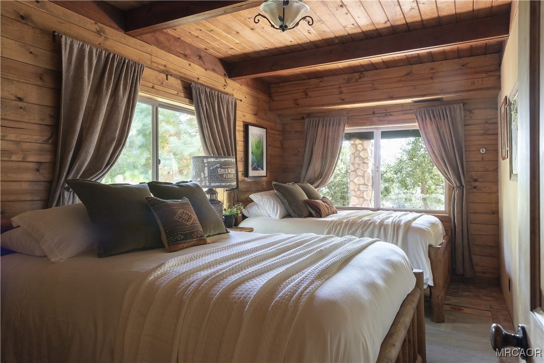 27710 West Shore Road Lake Arrowhead, CA 92352 - Photo 19 of 47 a bedroom with a bed and a large window