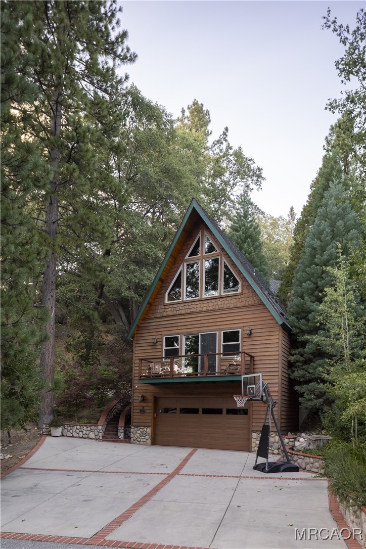 27710 West Shore Road Lake Arrowhead, CA 92352 - Photo 24 of 47 a front view of a house with a yard
