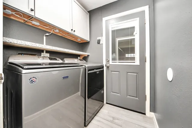 a close view of a sink and cabinets