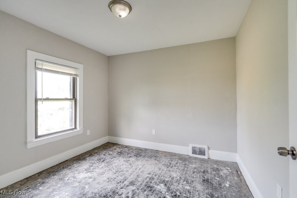 1618 Catalpa Road Cleveland, OH 44112 - Photo 20 of 33 Empty room featuring baseboards