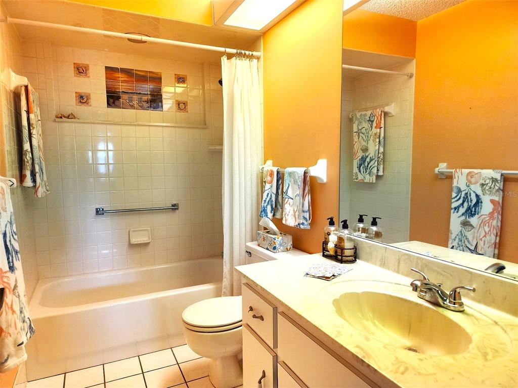 11660 Southwest 89th Terrace Ocala, FL 34481 - Photo 9 of 16 a bathroom with a granite countertop sink toilet and shower