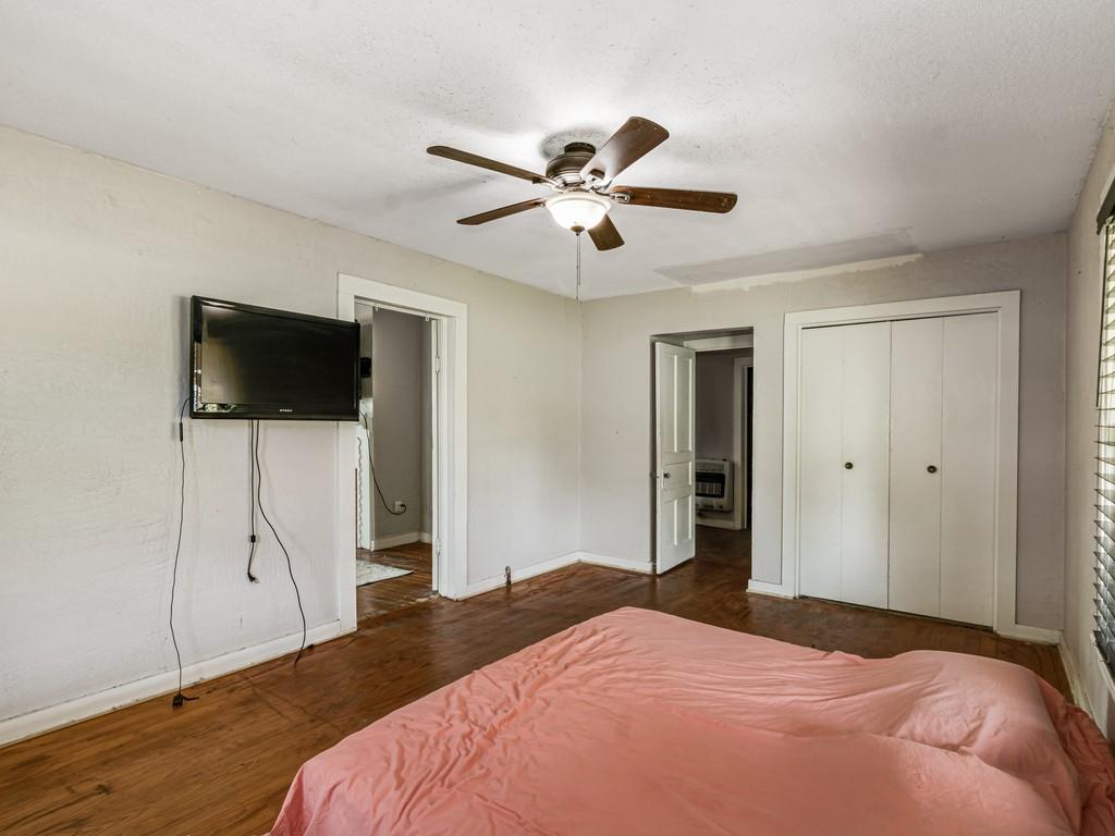 112 West Hackberry Street Malone, TX 76660 - Photo 12 of 38 a bedroom with a bed and a flat screen tv
