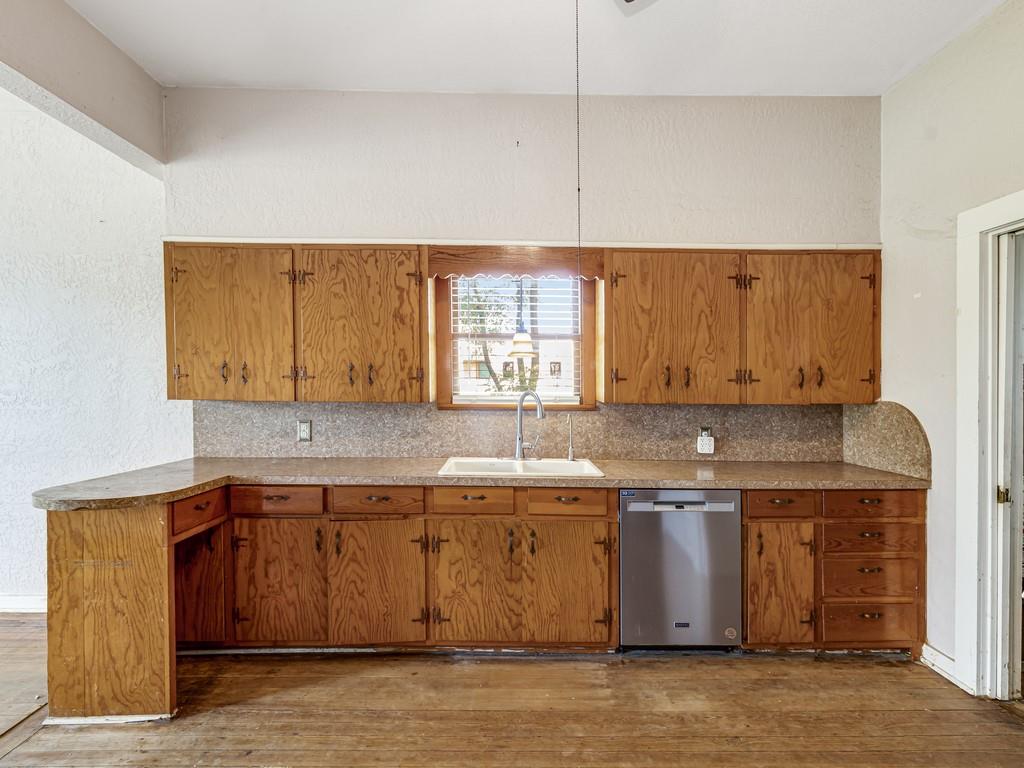 112 West Hackberry Street Malone, TX 76660 - Photo 13 of 38 a kitchen with a sink cabinets and window