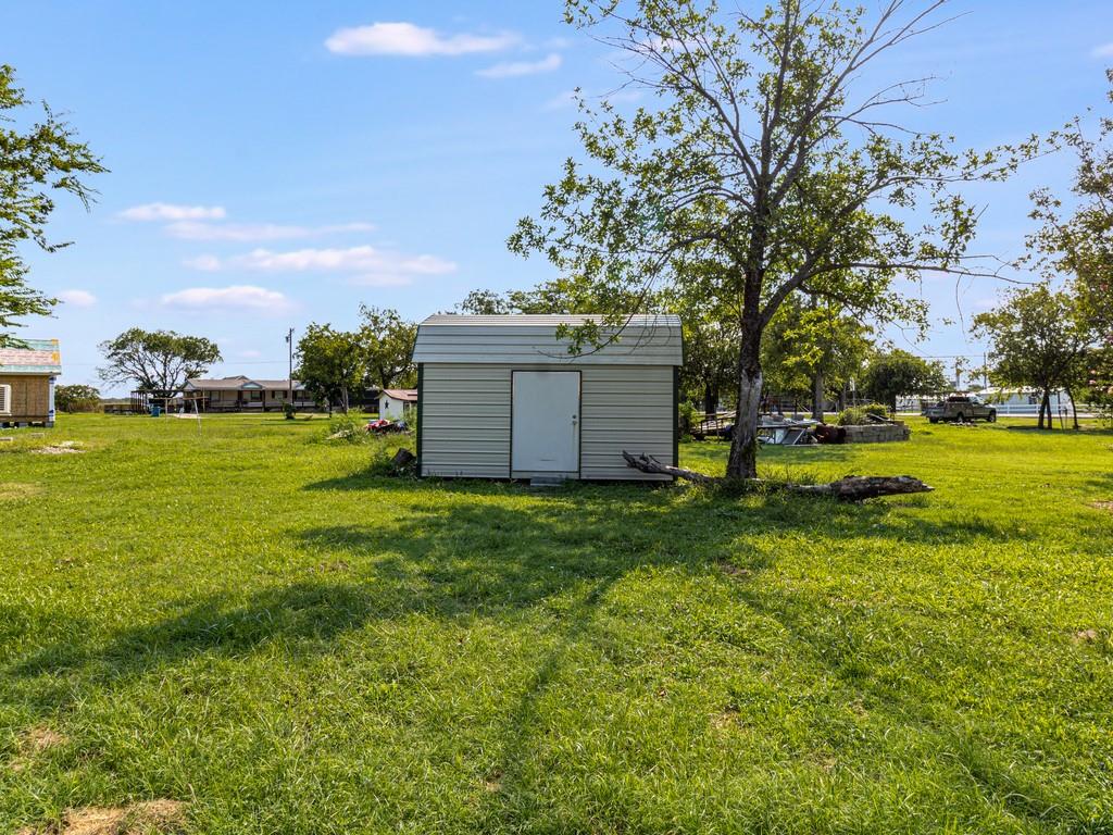 112 West Hackberry Street Malone, TX 76660 - Photo 18 of 38 a view of a golf course with a big yard