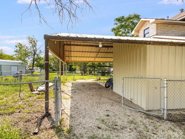 a view of a swimming pool with a patio