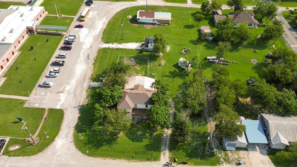 112 West Hackberry Street Malone, TX 76660 - Photo 37 of 38 an aerial view of a residential houses with outdoor space and street view