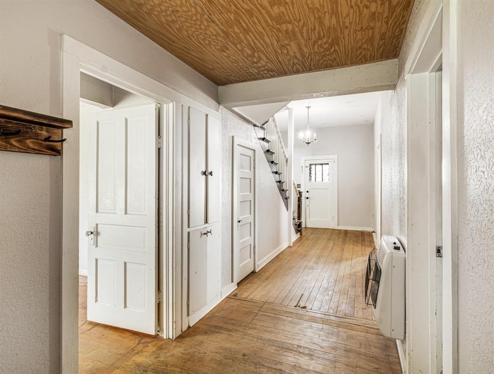 112 West Hackberry Street Malone, TX 76660 - Photo 6 of 38 a view of a hallway with wooden floor and staircase