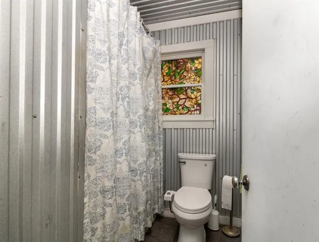 a bathroom with a toilet and a sink