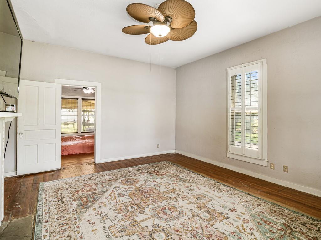 112 West Hackberry Street Malone, TX 76660 - Photo 8 of 38 a view of an empty room with window and wooden floor