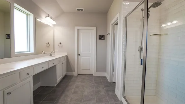 a bathroom with a double vanity sink mirror and double