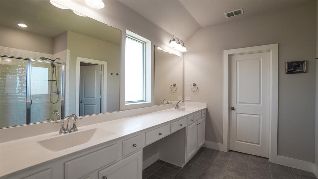 1836 Big Spring Drive Forney, TX 75126 - Photo 19 of 40 a bathroom with a double vanity sink mirror and double