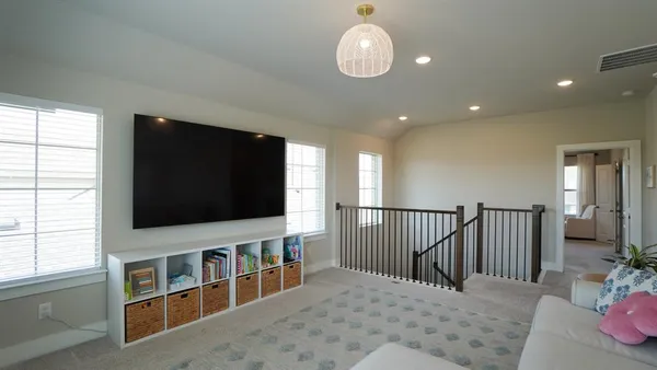 a kitchen with a refrigerator and cabinets
