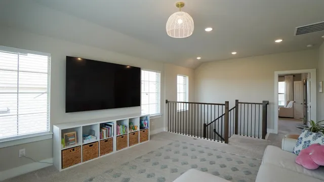a kitchen with a refrigerator and cabinets