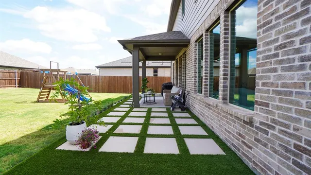a view of a house with a yard porch and sitting area