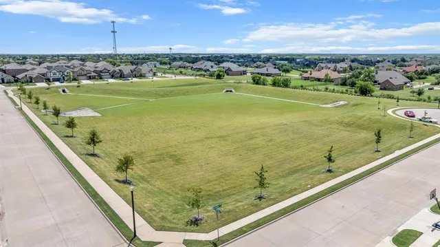 an aerial view of a residential building with outdoor space