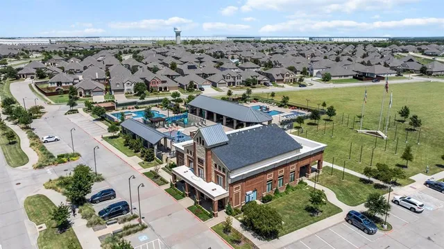 a view of swimming pool with outdoor seating and lake