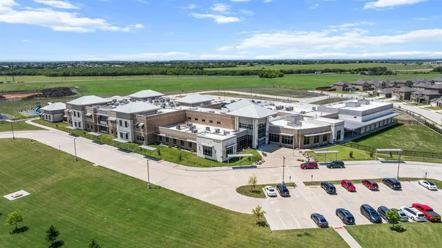 an aerial view of a house with outdoor space
