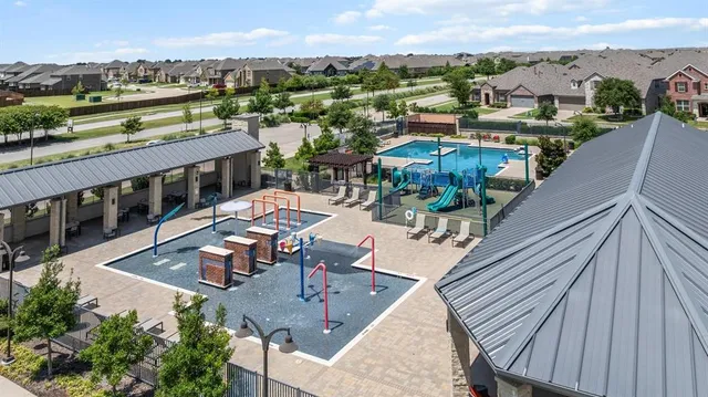 a view of a swimming pool with chairs