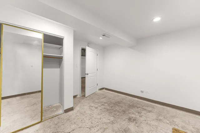 a view of a house with snow on the road