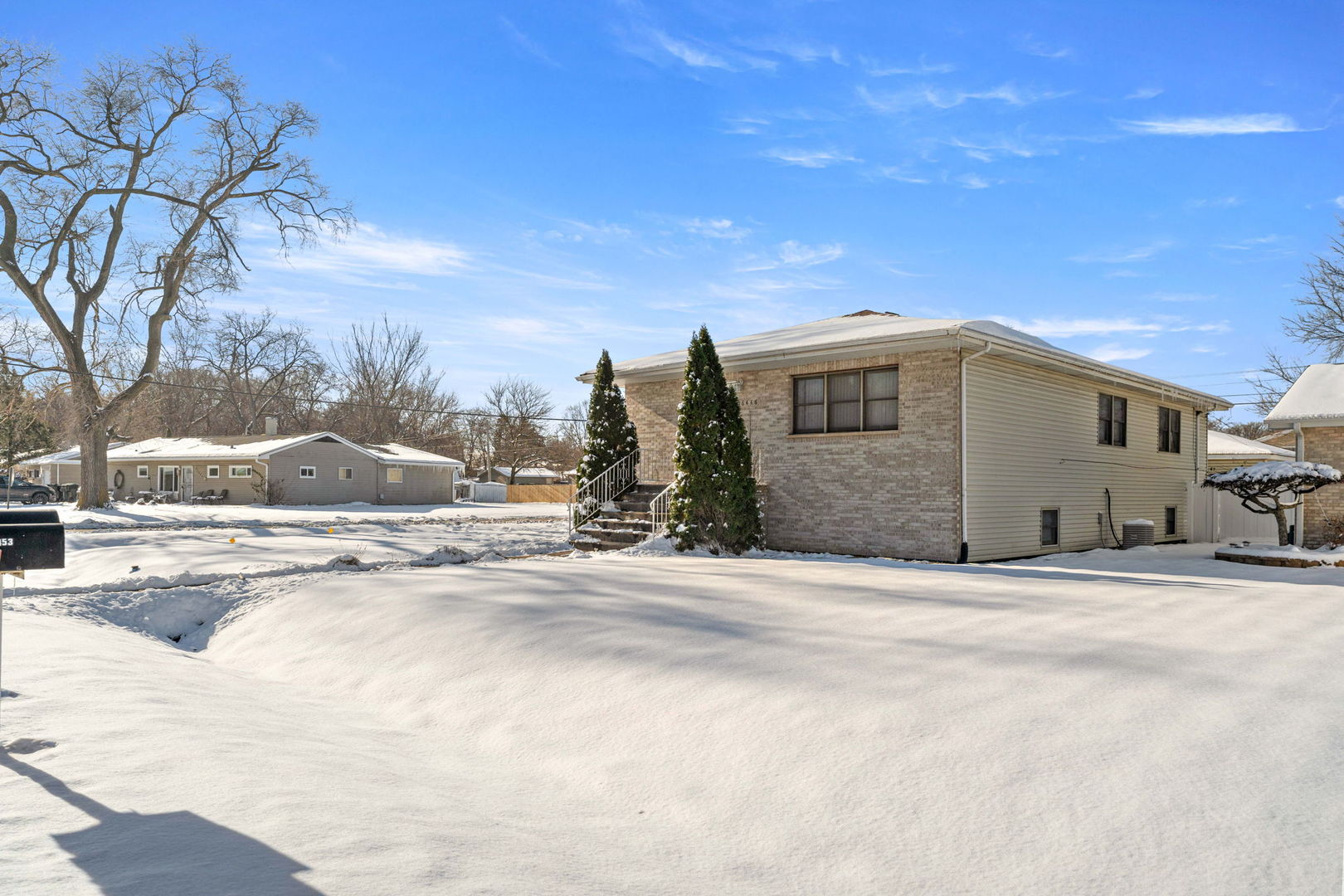 16446 Spaulding Avenue Markham, IL 60428 - Photo 23 of 27 a view of a house with snow on the road