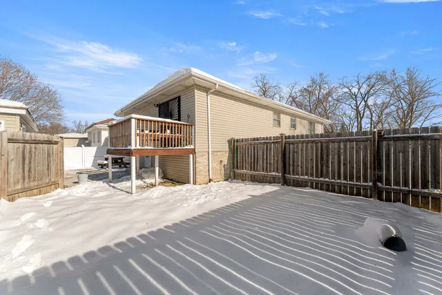 a view of a patio with wooden floor