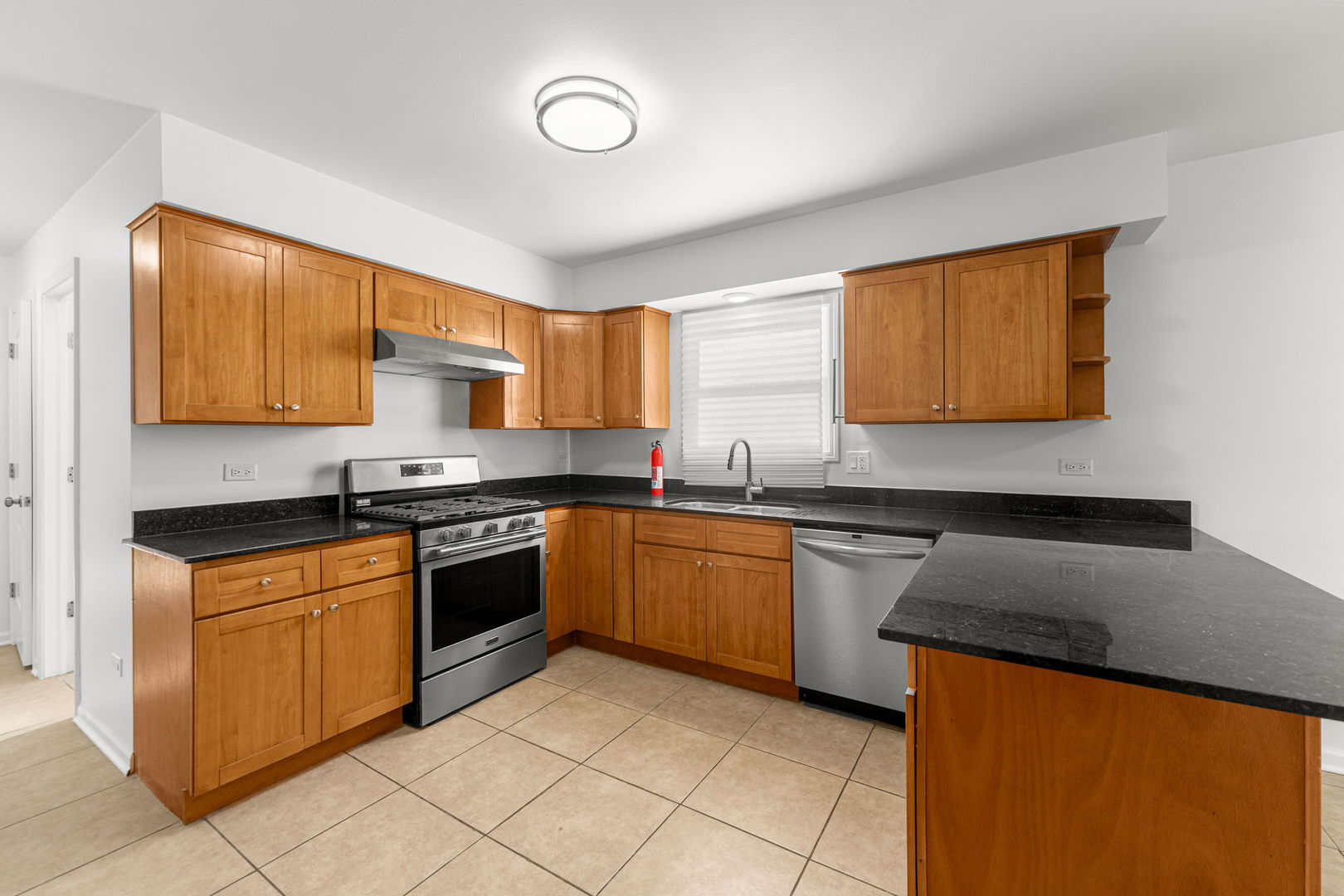 16446 Spaulding Avenue Markham, IL 60428 - Photo 4 of 27 a kitchen with stainless steel appliances granite countertop a sink and cabinets