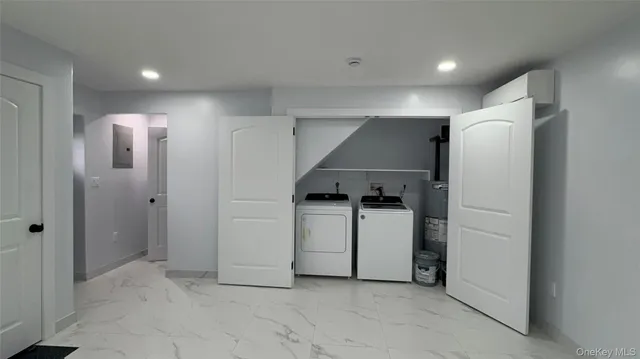 a view of a hallway with storage and utility room