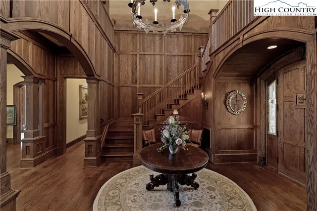 a living room with furniture and a chair