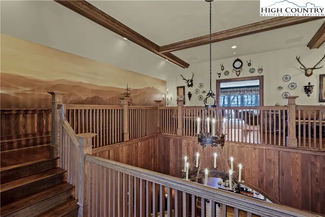 a bedroom with a large bed and a tv