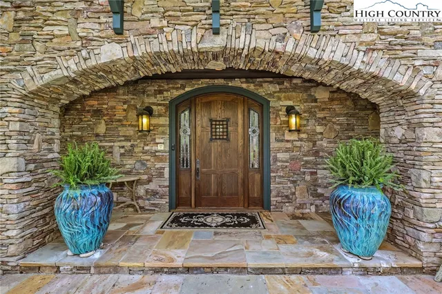 a view of a entryway door with wooden floor