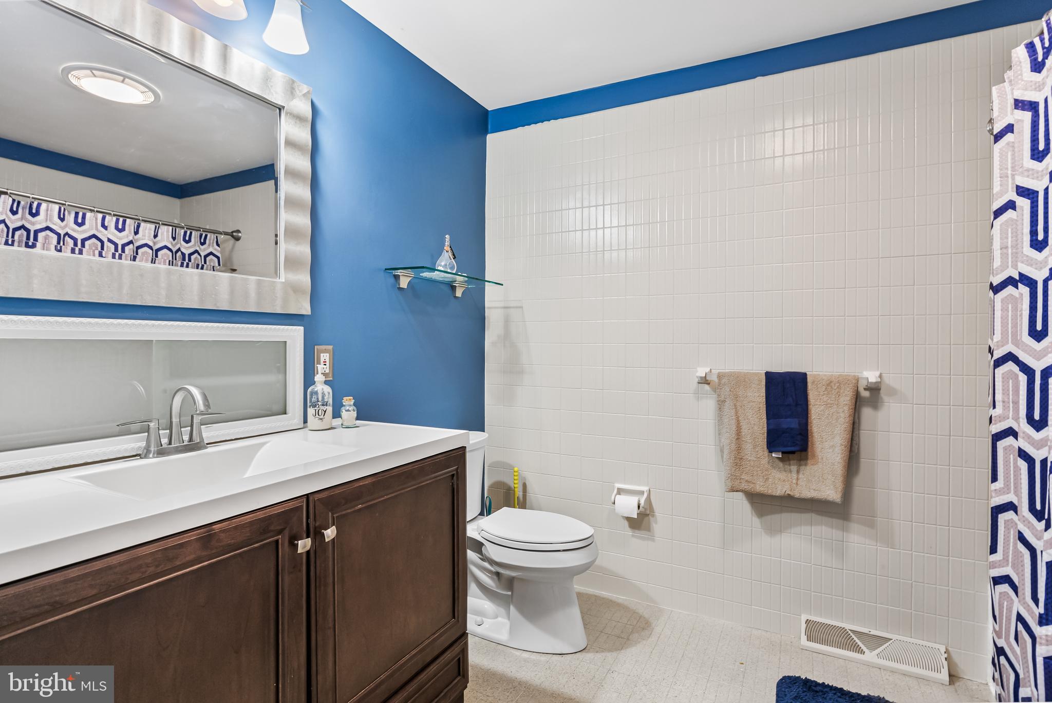 2802 Hunterdon Drive Cinnaminson, NJ 08077 - Photo 22 of 37 a bathroom with a sink a toilet and mirror
