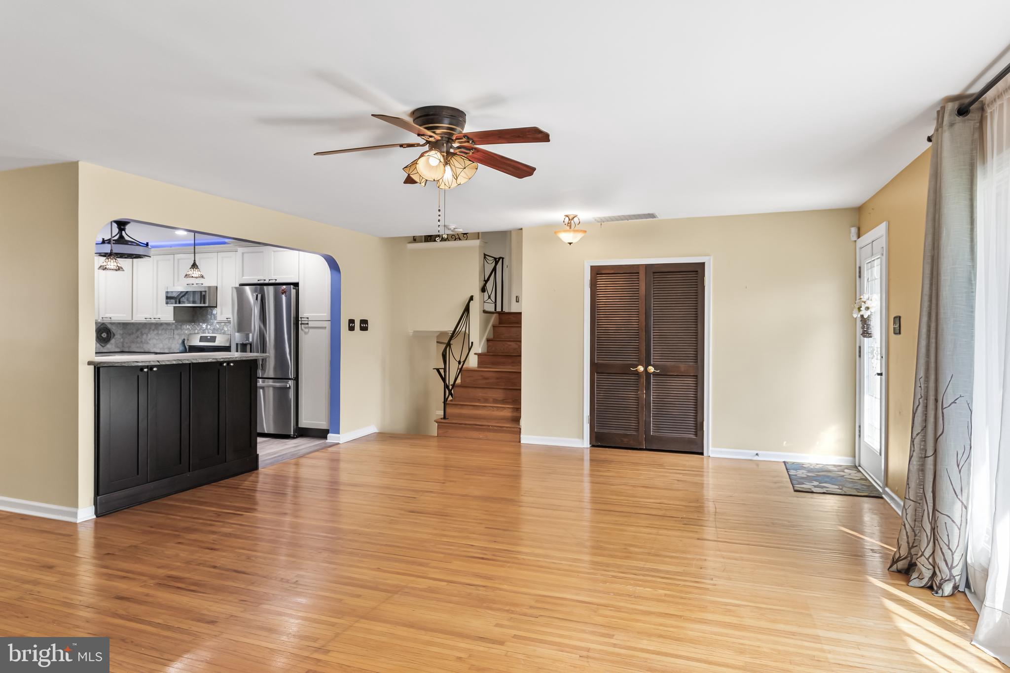 2802 Hunterdon Drive Cinnaminson, NJ 08077 - Photo 27 of 37 a view of a kitchen with a refrigerator a ceiling fan and wooden floor