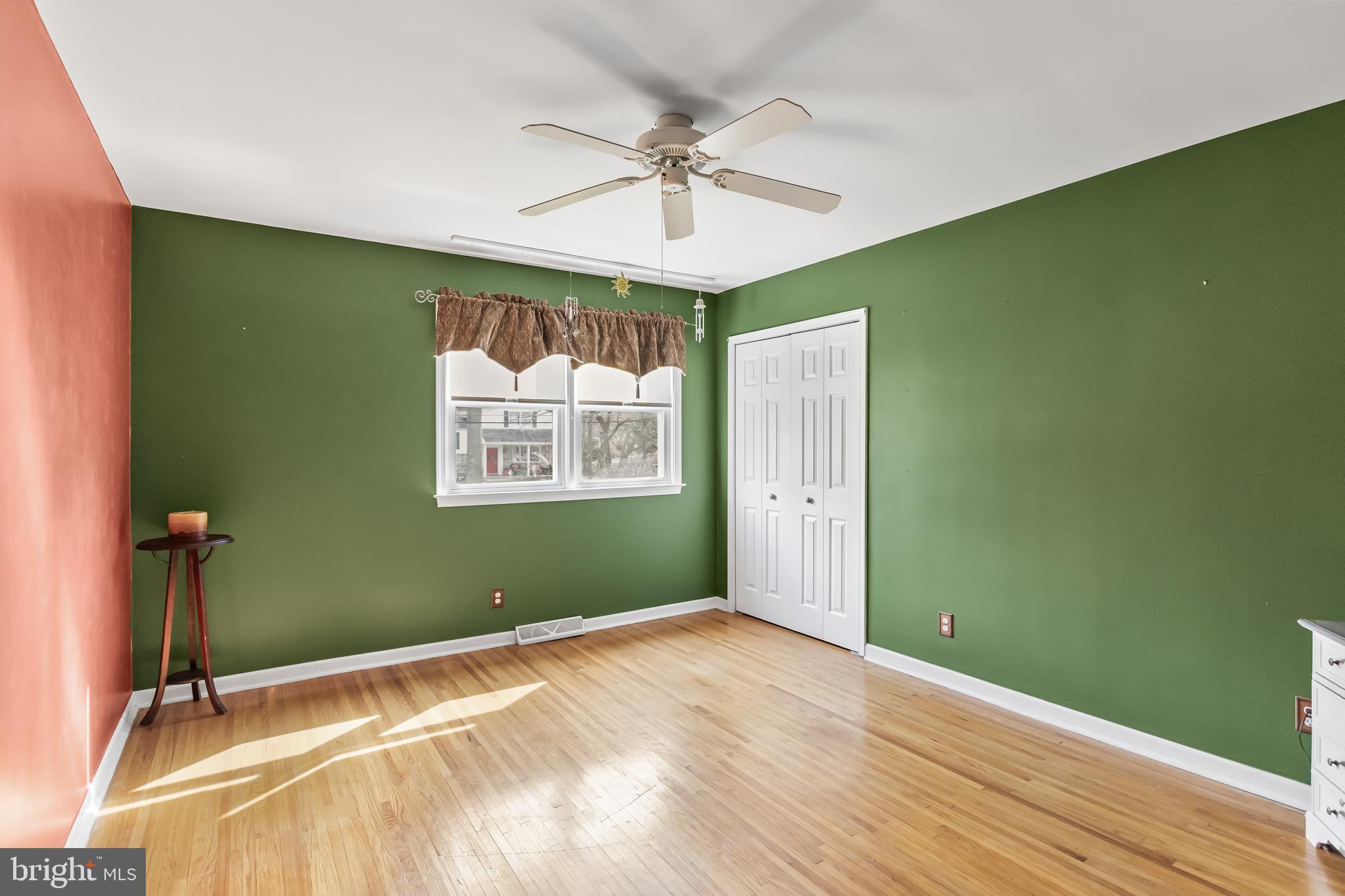 2802 Hunterdon Drive Cinnaminson, NJ 08077 - Photo 33 of 37 a view of a room with window a ceiling fan and wooden floor