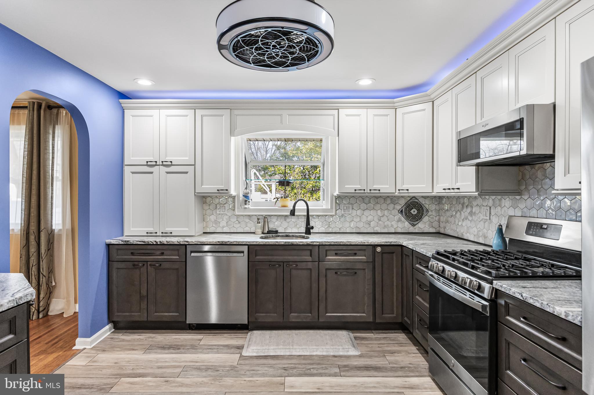 2802 Hunterdon Drive Cinnaminson, NJ 08077 - Photo 9 of 37 a kitchen with stainless steel appliances granite countertop a stove a sink and a microwave