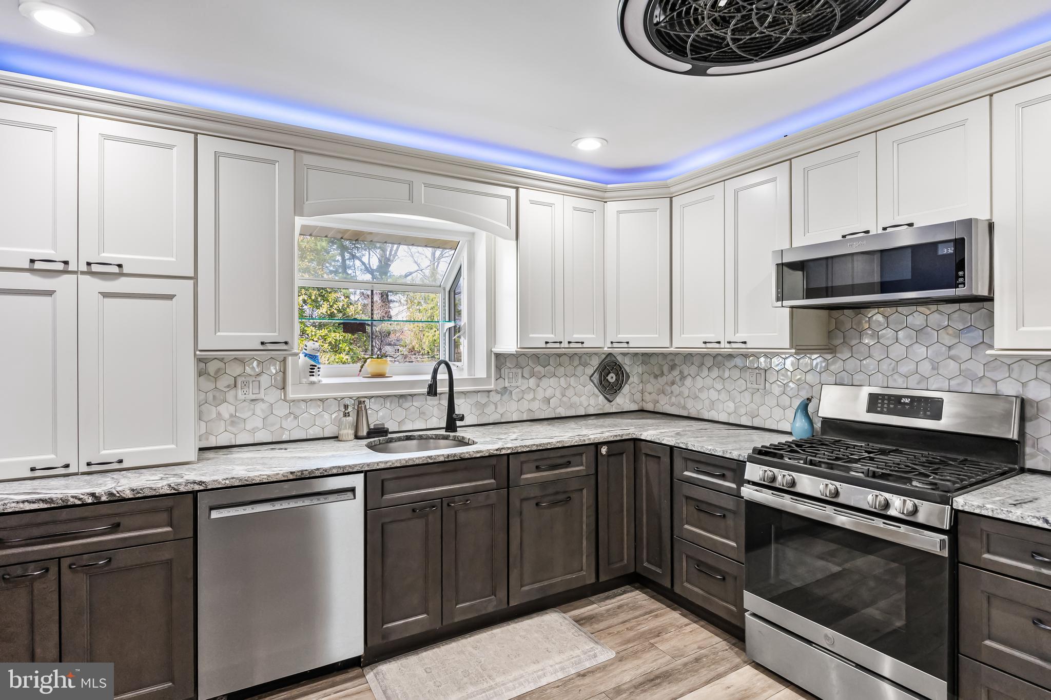 2802 Hunterdon Drive Cinnaminson, NJ 08077 - Photo 10 of 37 a kitchen with stainless steel appliances granite countertop a sink stove and cabinets