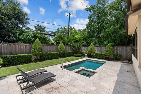 a view of a backyard with sitting area