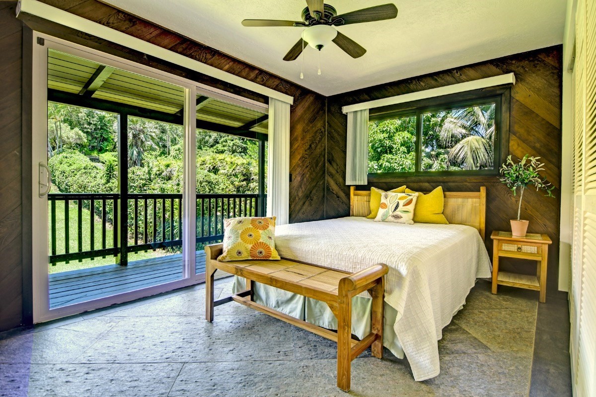 33 Poko Place Hilo, HI 96720 - Photo 16 of 28 a bedroom with a bed and a large window