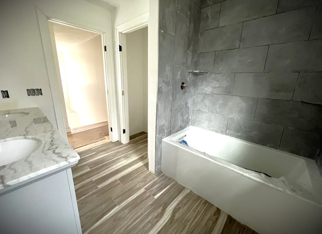 20 Cooper Road Webster, MA 01570 - Photo 33 of 41 a bathroom with a granite countertop sink a toilet and shower